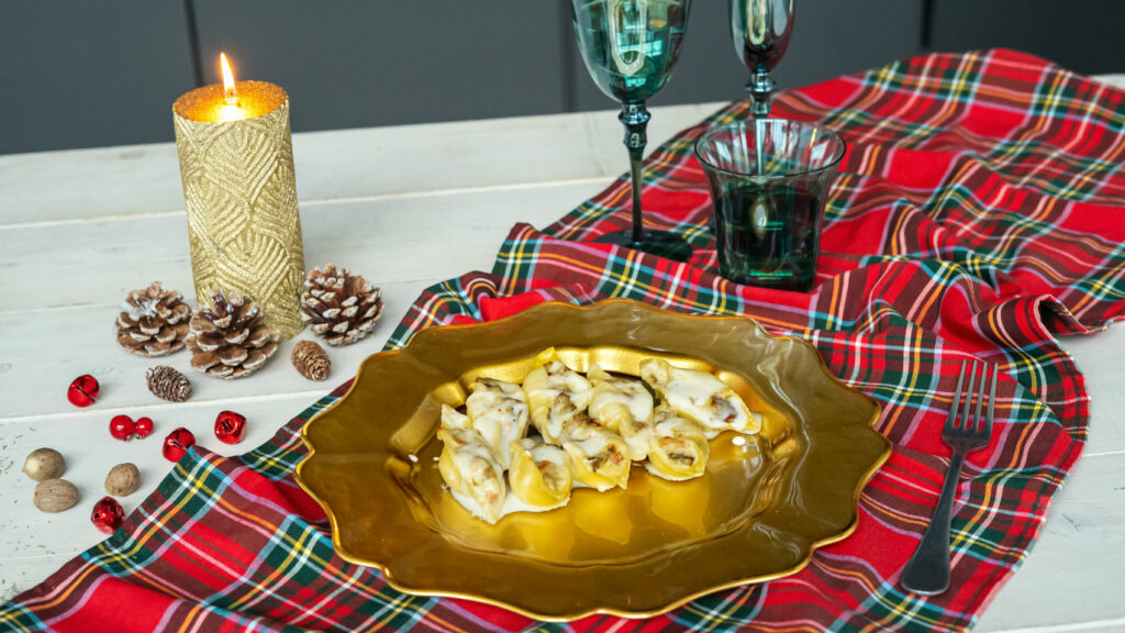 Conchiglioni ripieni di funghi, prosciutto e besciamella